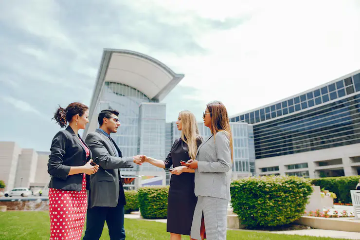 businessman-summer-city-with-three-women_1157-16330